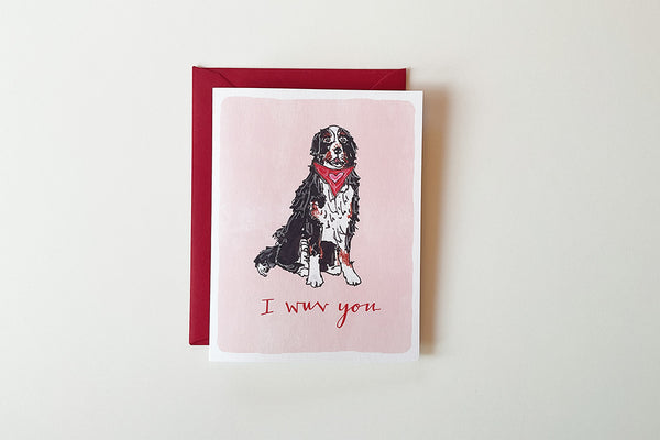 Card with a dog illustration and 'I wuv you' text on a pink background, with a red border.