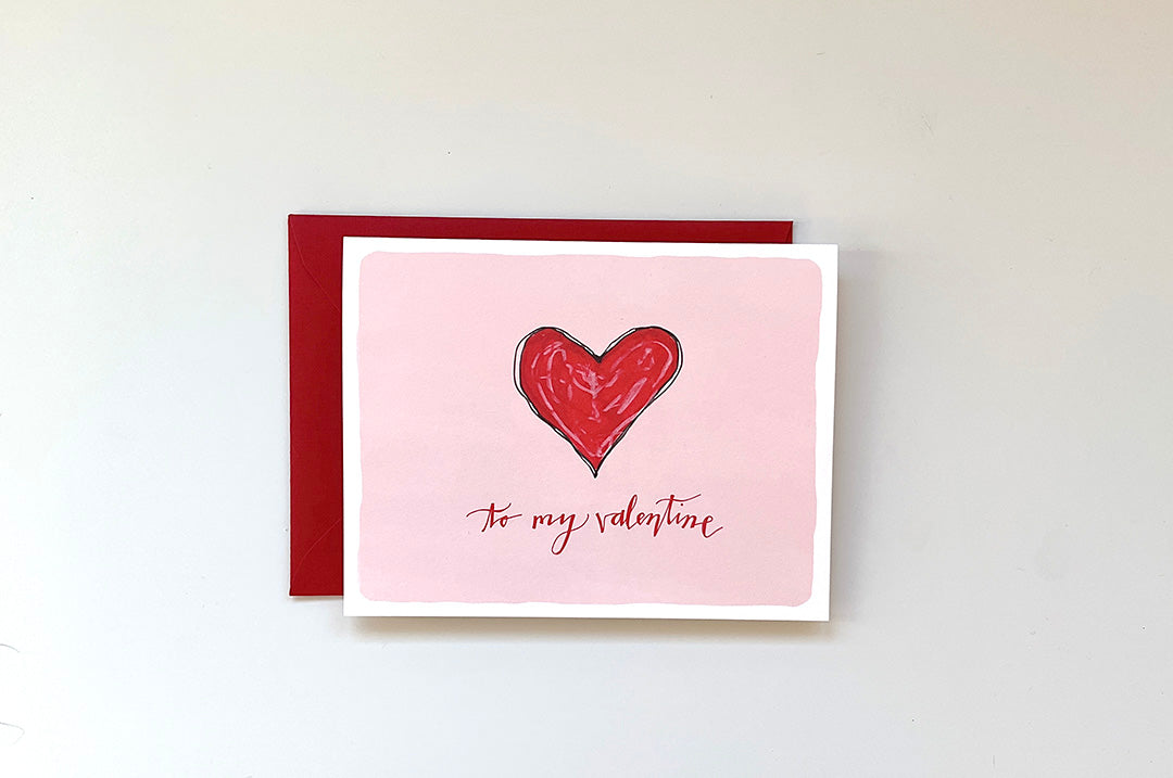 Card with a red heart and 'to my valentine' text on a white background