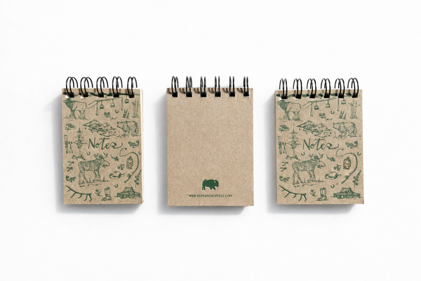 Three small notebooks with animal illustrations on a white background