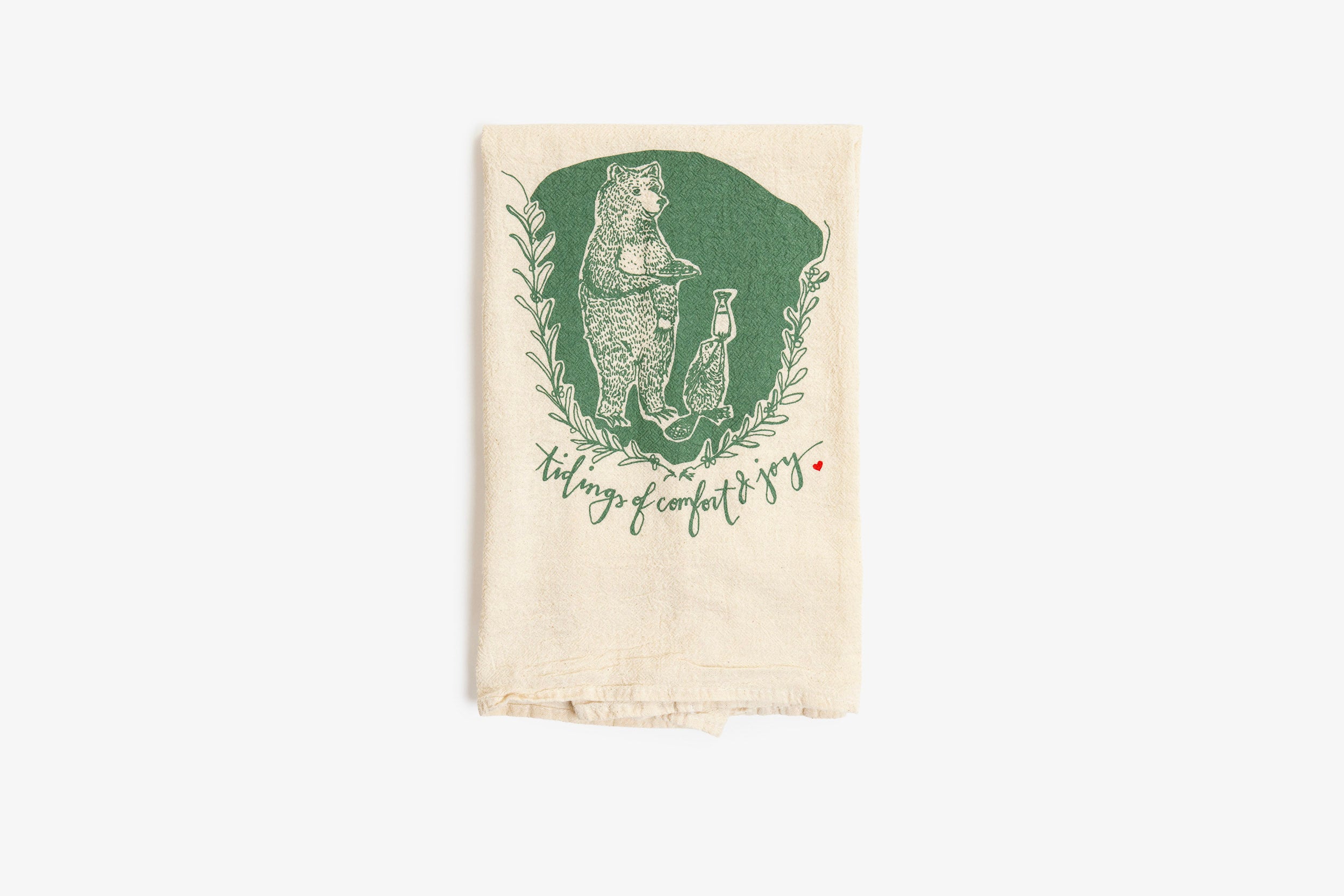 Tea towel with green graphic and text on a white background