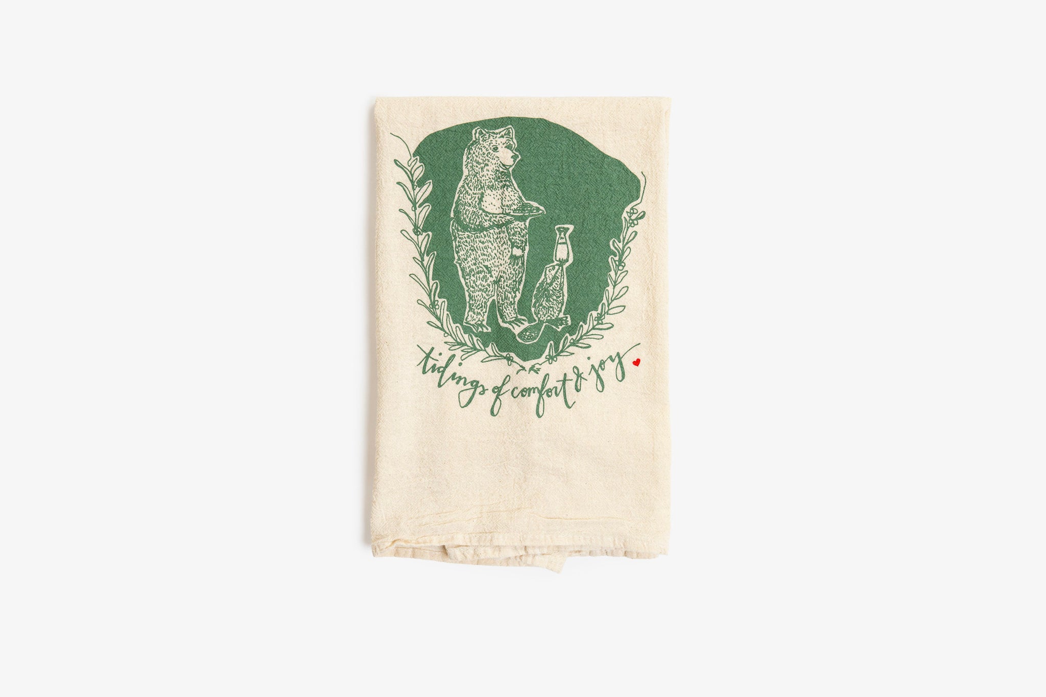 Tea towel with green graphic and text on a white background