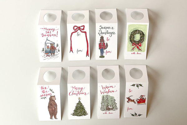 Set of eight Christmas-themed gift tags on a white background