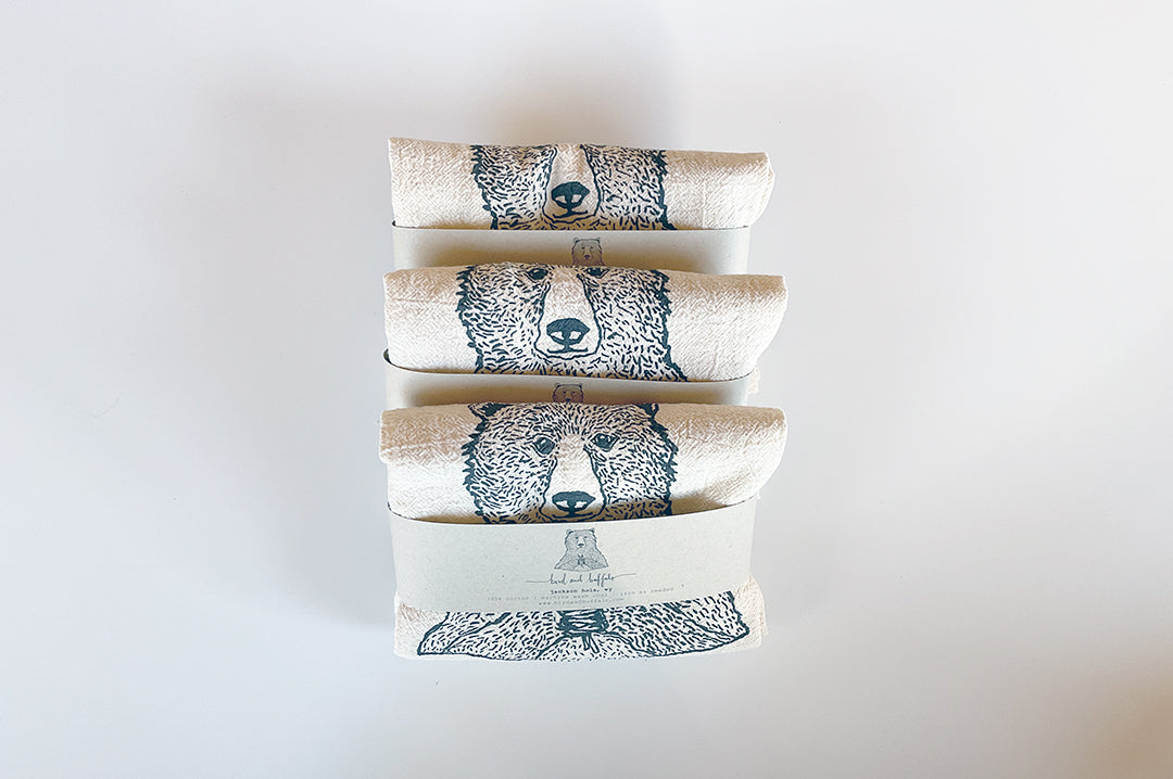 Bear Holding Flowers