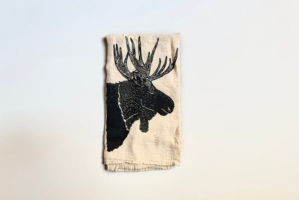 Towel with black moose design on a light background
