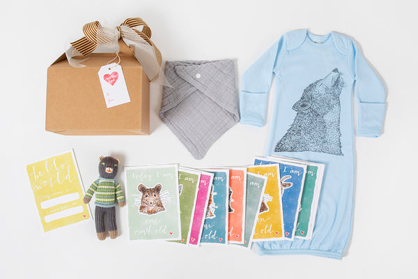 Western newborn baby gift box with onesie and milestone cards