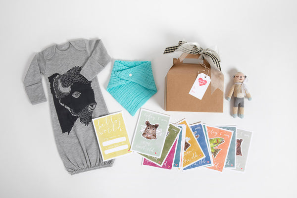 Western newborn baby gift box with onesie and milestone cards