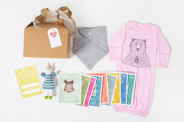Western newborn baby gift box with onesie and milestone cards